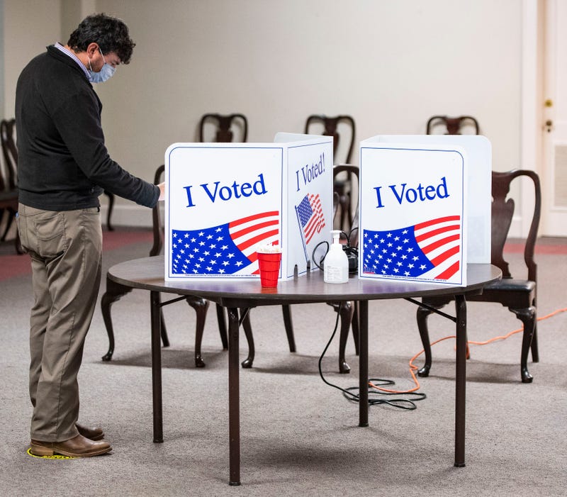 Brandon Scott, of Greenville, fills out his ballot at Augusta Road Baptist Church, in Greenville, Tuesday, November 2, 2021. 
