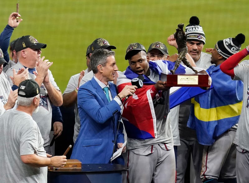 Nov 2, 2021; Houston, TX, USA; Atlanta Braves designated hitter Jorge Soler hoists the World Series MVP trophy after defeating the Houston Astros in game six of the 2021 World Series at Minute Maid Park. Mandatory Credit: Thomas Shea-USA TODAY Sports