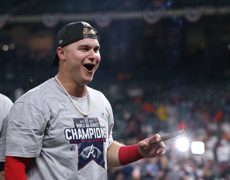 Atlanta Braves right fielder Joc Pederson celebrates with a cigar after defeating the Houston Astros in game six of the 2021 World Series at Minute Maid Park.