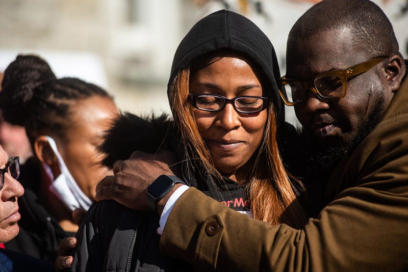Michelle Surrency, the mother of Monica Goods, is comforted by Rev. Kevin McCall as she talks during a press conference outside the Ulster County Courthouse after the bail hearing for New York State Trooper Christopher Baldner in Kingston, NY on Thursday, November 4, 2021. Baldner's bail was denied.
