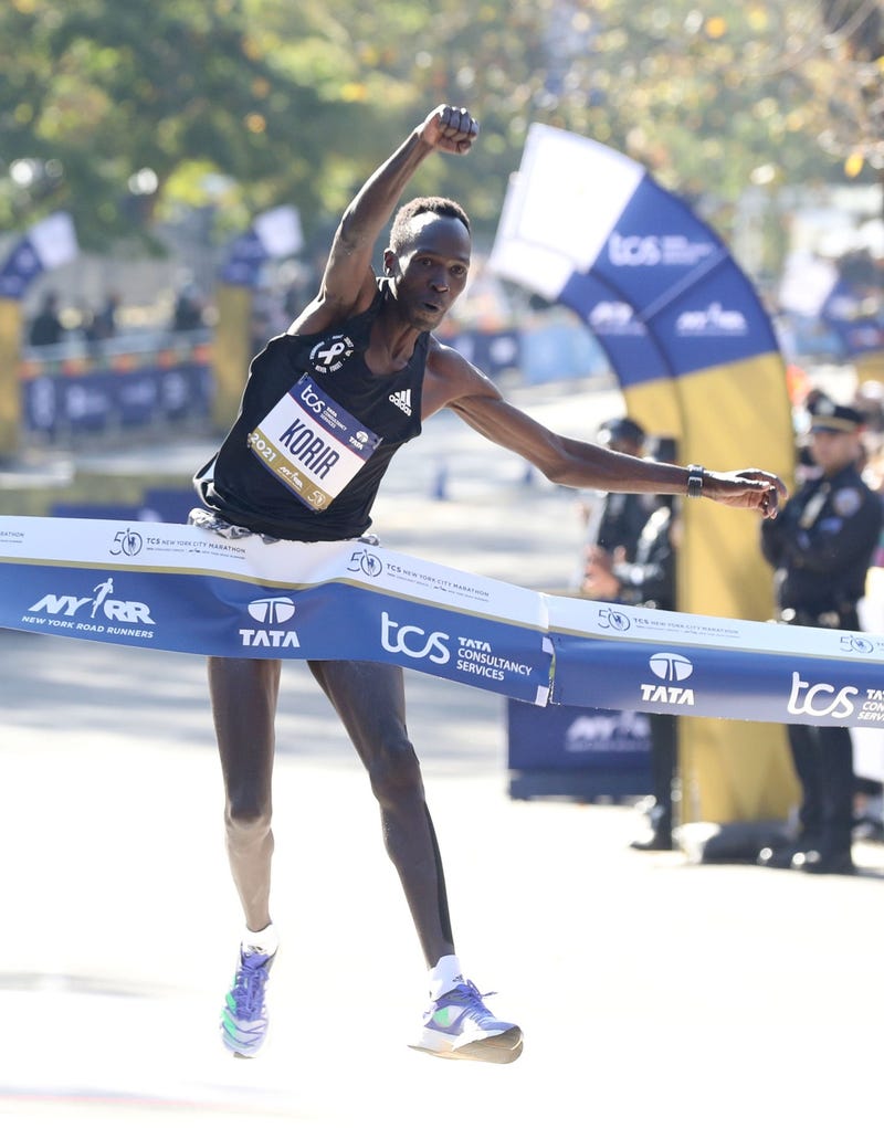 Albert Korir of Kenya leaps across the finish line as he wins the men's race at the New York City Marathon Nov 7, 2021. He finished with a time of 2 hours 8 minutes 22 seconds.