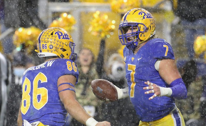 Pittsburgh Panthers tight end Lucas Krull (7) reacts with tight end Gavin Bartholomew (86) after Krull scored a touchdown against the North Carolina Tar Heels in overtime at Heinz Field.