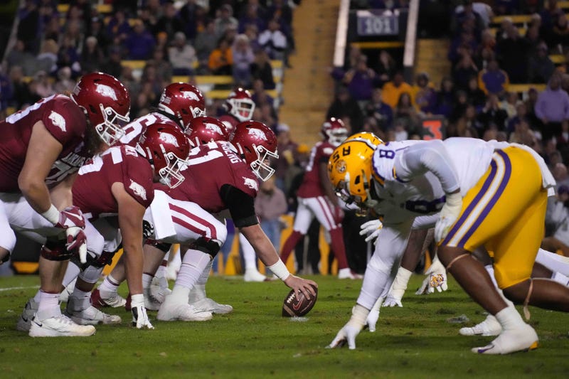 Arkansas Razorbacks offensive lineman Ricky Stromberg (51) snaps the ball at the line of scrimmage against the LSU Tigers at Tiger Stadium