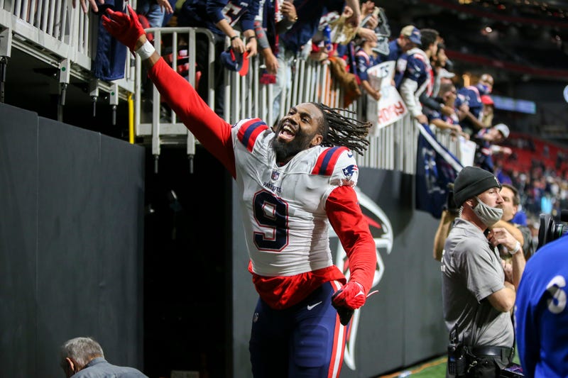 New England Patriots linebacker Matthew Judon (9) celebrates with fans after a victory against the Atlanta Falcons at Mercedes-Benz Stadium.