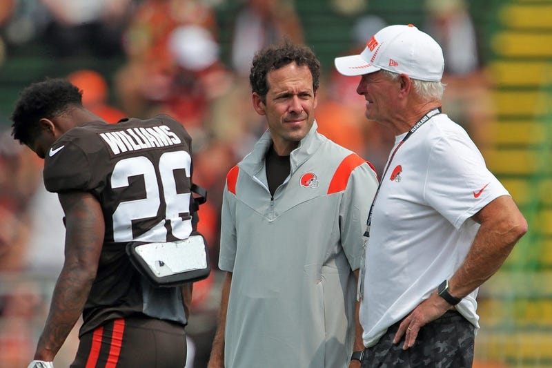 Cleveland Browns chief strategy officer Paul DePodesta, left, and owner Jimmy Haslam, right, chat on the sideline during practice, Tuesday, Aug. 10, 2021, in Berea, Ohio. Browns 18