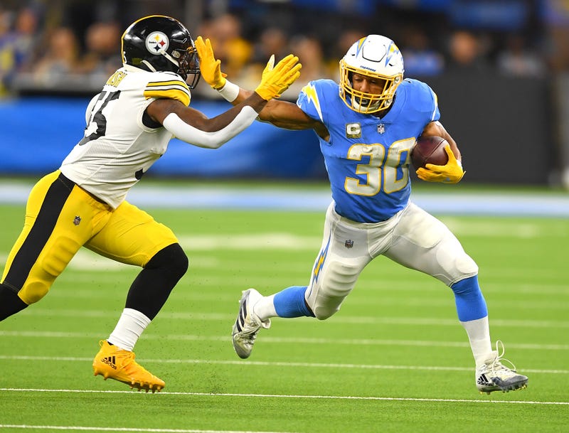 Los Angeles Chargers running back Austin Ekeler (30) pushes off Pittsburgh Steelers inside linebacker Devin Bush (55)