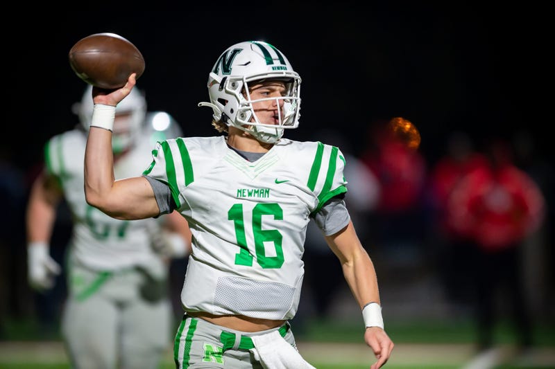 Quarterback Arch Manning 16 throws a pass as Newman takes on Lafayette Christian Academy
