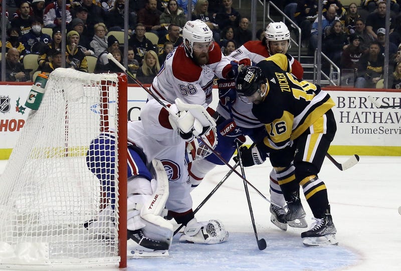 Jason Zucker battling in front of the Montreal net