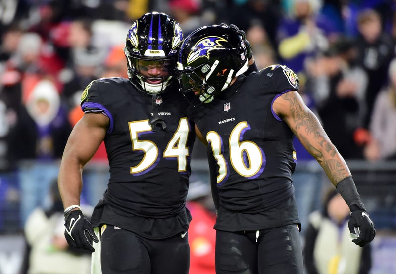 Tyus Bowser and Chuck Clark celebrate the Ravens' win over Cleveland