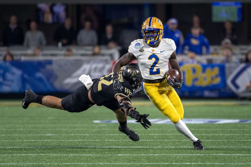 Pittsburgh Panthers running back Israel Abanikanda (2) with the ball as Wake Forest Demon Deacons defensive back Luke Masterson (12)