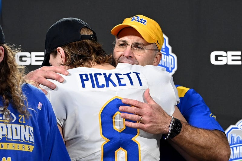 Kenny Pickett hugged by Pat Narduzzi