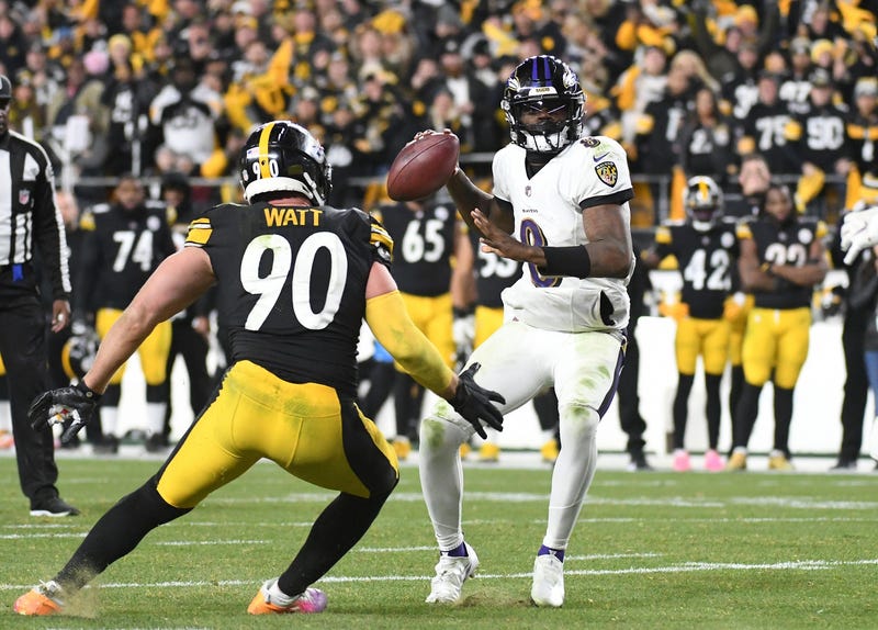 Dec 5, 2021; Pittsburgh, Pennsylvania, USA; Baltimore Ravens quarterback Lamar Jackson (8) is pressured by Pittsburgh Steelers linebacker T.J. Watt (90) on a two-point conversion play with 12 seconds remaining in the fourth quarter at Heinz Field. 