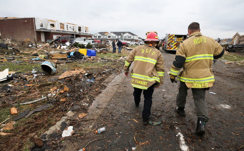 Members of the Bowling Green Fire Department worked the scene where homes were damaged near Creekwood Ave. in Bowling Green, Ky. on Dec. 11, 2021. A tornado cut a path through several states, including Kentucky, which resulted in fatalities.