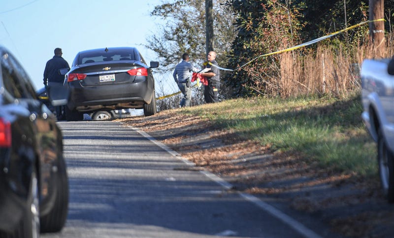 Anderson County Sheriff Deputies and investigators work the scene where a body was found in Starr, S.C. Tuesday, December 14, 2021.