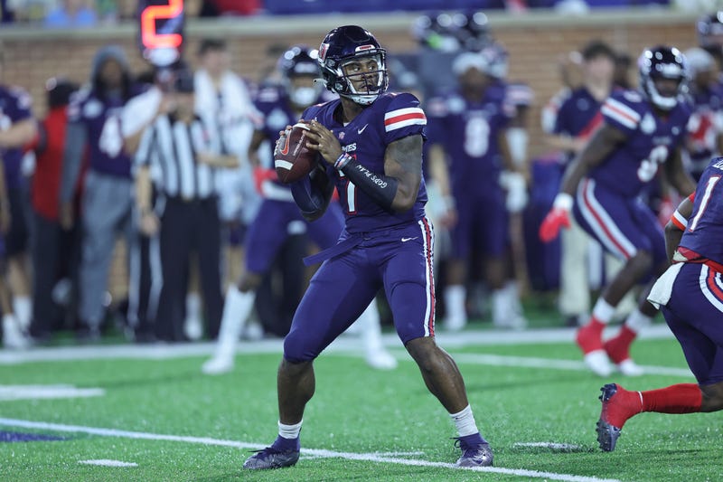 Dec 18, 2021; Mobile, Alabama, USA; Liberty Flames quarterback Malik Willis (7) sets up to pass in the first quarter against Eastern Michigan Eagles during the 2021 LendingTree Bowl at Hancock Whitney Stadium.