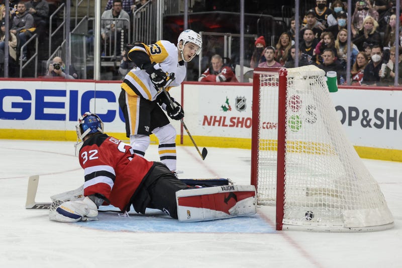 Penguins center Teddy Blueger (53) scores a goal past New Jersey Devils goaltender Jon Gillies (32)