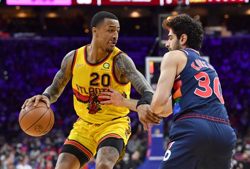 Dec 14, 2021; Philadelphia, Pennsylvania, USA; Atlanta Hawks forward John Collins (20) moves to the basket against Philadelphia 76ers guard Furkan Korkmaz (30) during the second quarter at Wells Fargo Center.