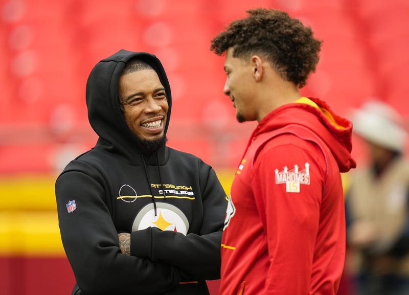 Pittsburgh Steelers cornerback Joe Haden (left) talks with Kansas City Chiefs quarterback Patrick Mahomes (15) 