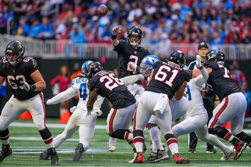 Atlanta Falcons quarterback Matt Ryan (2) passes the ball under pressure from the Detroit Lions during the second half at Mercedes-Benz Stadium. 