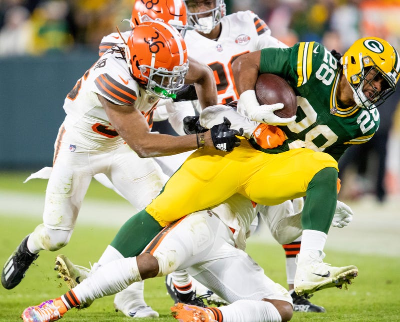 Green Bay Packers running back A.J. Dillon (28) runs the ball against the Cleveland Browns in the second quarter during their football game Saturday, December 25, 2021, at Lambeau Field in Green Bay, Wis. Samantha Madar/USA TODAY NETWORK