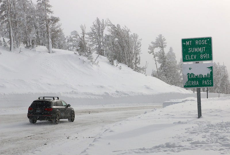A car maneuvers through snowy conditions in northern Nevada