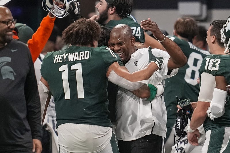 Connor Heyward hugs MSU coach