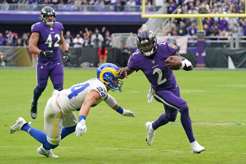 Baltimore Ravens quarterback Tyler Huntley (2) runs for a gain