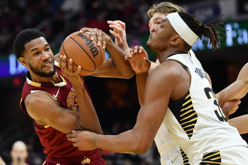 Jan 2, 2022; Cleveland, Ohio, USA; Cleveland Cavaliers forward Evan Mobley (4) drives to the basket against Indiana Pacers center Myles Turner (33) during the second half at Rocket Mortgage FieldHouse. 