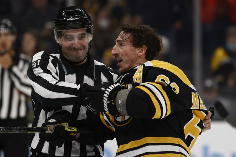 Brad Marchand being pulled away from the scrum that cost him a six game suspension