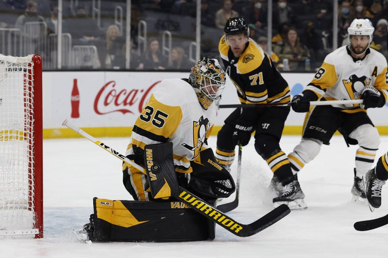 Pittsburgh Penguins goaltender Tristan Jarry (35) makes a blocker save against the Boston Bruins during the third period at TD Garden. 