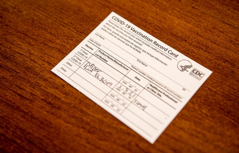 A COVID-19 vaccination card on a table