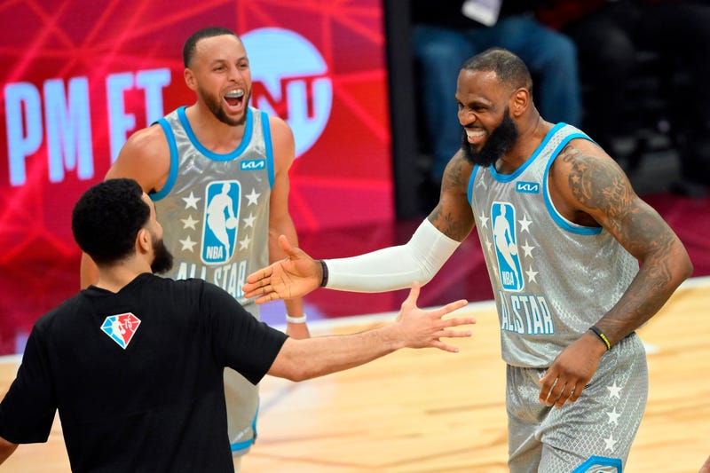 Lebron James, Steph Curry, and Fred Van Vleet celebrate an All-Star game win