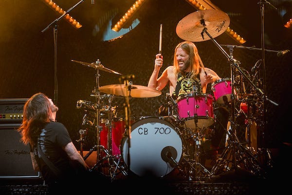 Foo Fighters frontman, Dave Grohl, left, and drummer, Taylor Hawkins, right, perform at Innings Festival 2022 in Tempe Beach Park