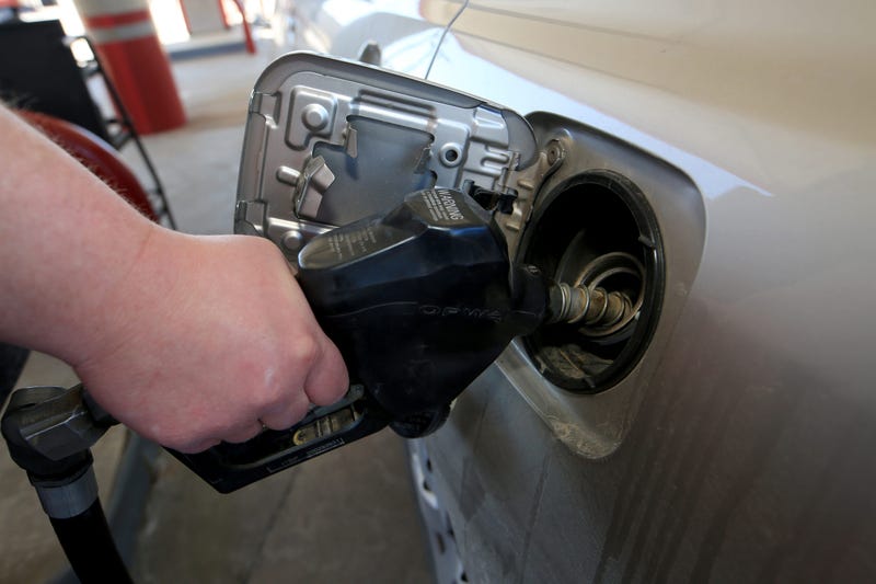 Joe Durazo helps customers who pull into the full service pump area Tuesday morning, March 1, 2022,