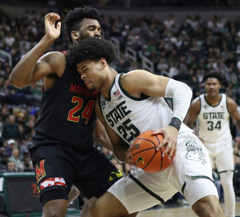 Michigan State Spartans forward Malik Hall (25) drives against Maryland Terrapins forward Donta Scott (24)