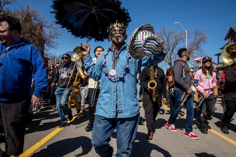 Scenes from the Marche du Nain Rouge, a parade made up of Detroiters, on Second Avenue.