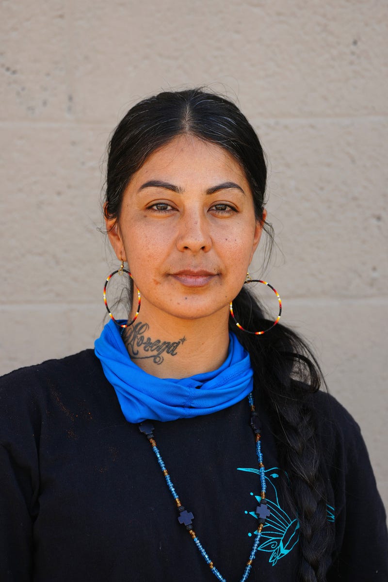 Lucinda Hinojos paints a mural honoring Arizona Republic photographer Nick Oza on March 1, 2022, in Phoenix. 
