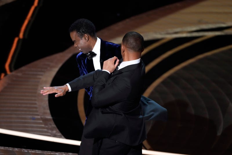 Mar 27, 2022; Los Angeles, CA, USA; Will Smith confronts Chris Rock as he presents the award for best documentary feature during the 94th Academy Awards at the Dolby Thea