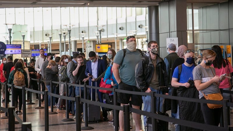 Long line of passengers waiting to get through security at the airport