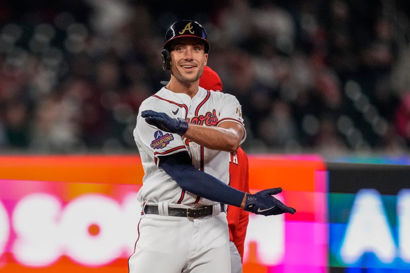 Apr 8, 2022; Cumberland, Georgia, USA; Atlanta Braves first baseman Matt Olson (28) reacts after hitting a double against the Cincinnati Reds during the sixth inning at Truist Park.