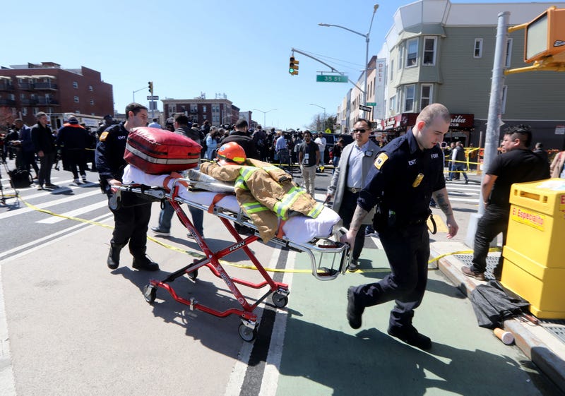 USA; EMT's from the New York City Fire Department work near the scene of a subway shooting in Brooklyn, New York on April 12, 2022 where at least ten people were shot during the morning rush hour.
