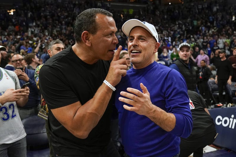 Minnesota Timberwolves co-minority owners Alex Rodriguez and Marc Lore celebrate a victory over the Los Angeles Clippers after a play-in game at Target Center.  