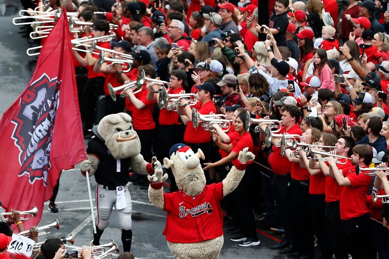 Atlanta Braves mascot Blooper and Georgia mascot Hairy Dawg fire up fans at the Dawg Walk before the start of the G-Day spring football game in Athens, Ga., on Saturday, April 16, 2022.