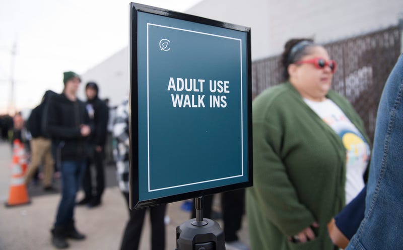 People wait in line outside of the Curaleaf dispensary in Bellmawr as the first sales of recreational marijuana sales in New Jersey took place on April 21, 2022.