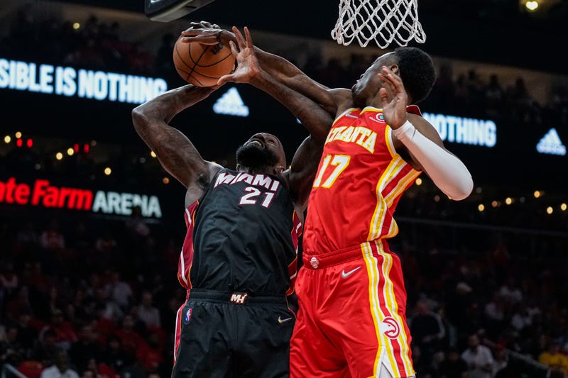 Apr 22, 2022; Atlanta, Georgia, USA; Miami Heat center Dewayne Dedmon (21) has his shot blocked by Atlanta Hawks forward Onyeka Okongwu (17) during the first half of game three of the first round for the 2022 NBA playoffs at State Farm Arena. Dale Zanine-USA TODAY Sports