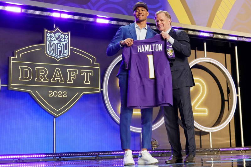 Notre Dame safety Kyle Hamilton with NFL commissioner Roger Goodell after being selected as the fourteenth overall pick to the Baltimore Ravens during the first round of the 2022 NFL Draft at the NFL Draft Theater.