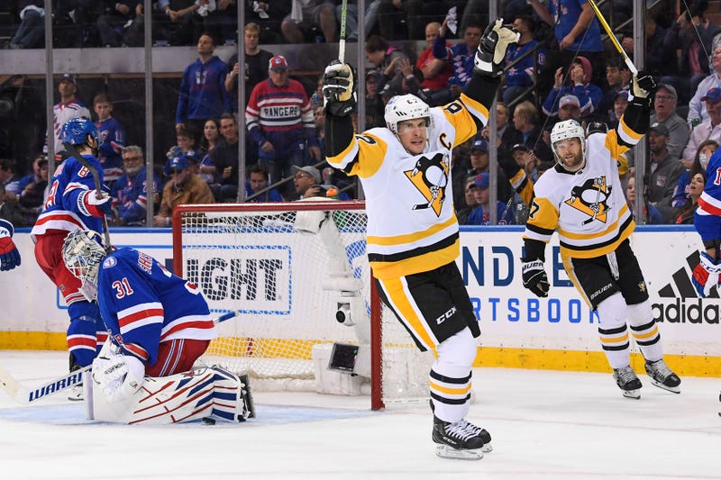 Pittsburgh Penguins center Sidney Crosby (87) scores a goal on New York Rangers goaltender Igor Shesterkin (31)
