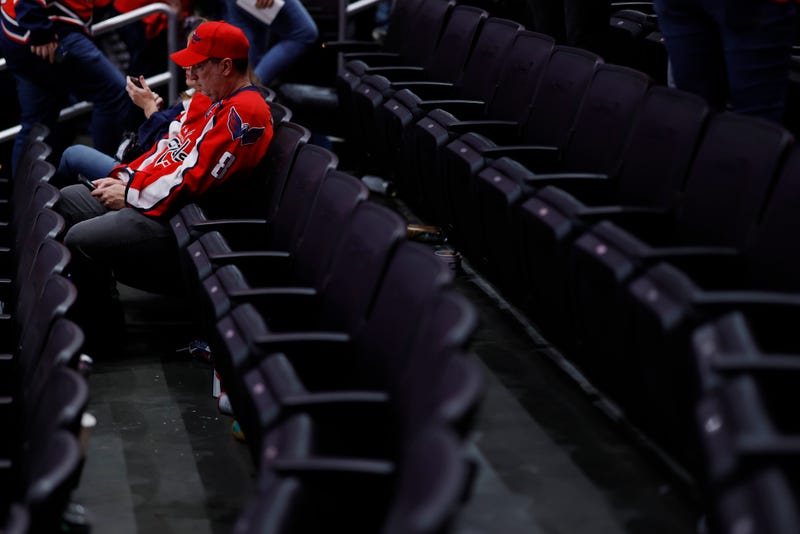 Capitals fans sit in the stands after the Capitals' game against the Florida Panthers in game six of the first round of the 2022 Stanley Cup Playoffs at Capital One Arena.