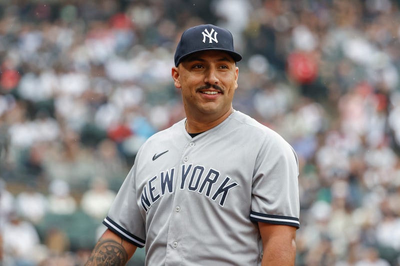 New York Yankees starting pitcher Nestor Cortes (65) smiles as he returns to dugout after pitching against the Chicago White Sox during the eight inning at Guaranteed Rate Field.