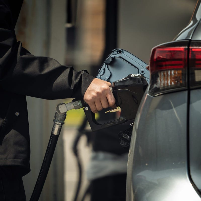 Person pumping gas